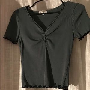 Green crop top with black detail